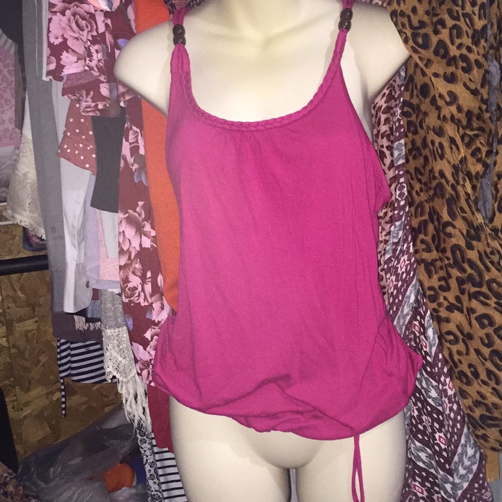 Maurice’s maroon tank